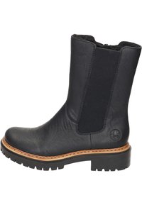 Botte de cheville en cuir noir avec panneaux latéraux élastiques, surface texturée, accents cousus et semelle en caoutchouc épaisse.