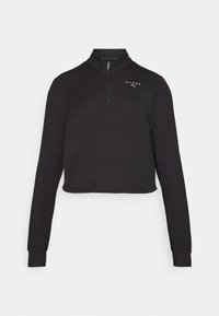 Felpa nera corta con colletto alto e zip a quarto di giro. Presenta maniche lunghe e un logo sul petto. Tessuto dalla texture liscia.