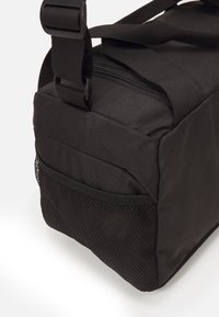 Puma FUNDAMENTALS BAG XS UNISEX - Αθλητική τσάντα - black