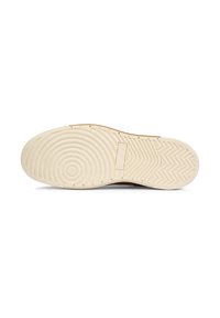 Shoe sole with a textured pattern, featuring circular grooves and a herringbone design. Color is light beige with a smooth finish.