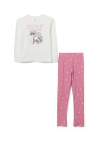Long-sleeve white pajama top with raccoon graphic and pink text; paired with pink star-patterned leggings. Both made from soft, stretchable fabric.