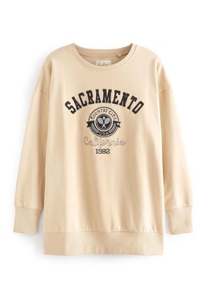 Sweat-shirt beige à manches longues avec "Sacramento Country Club USA California 1982" et des raquettes de tennis croisées imprimées sur le devant.