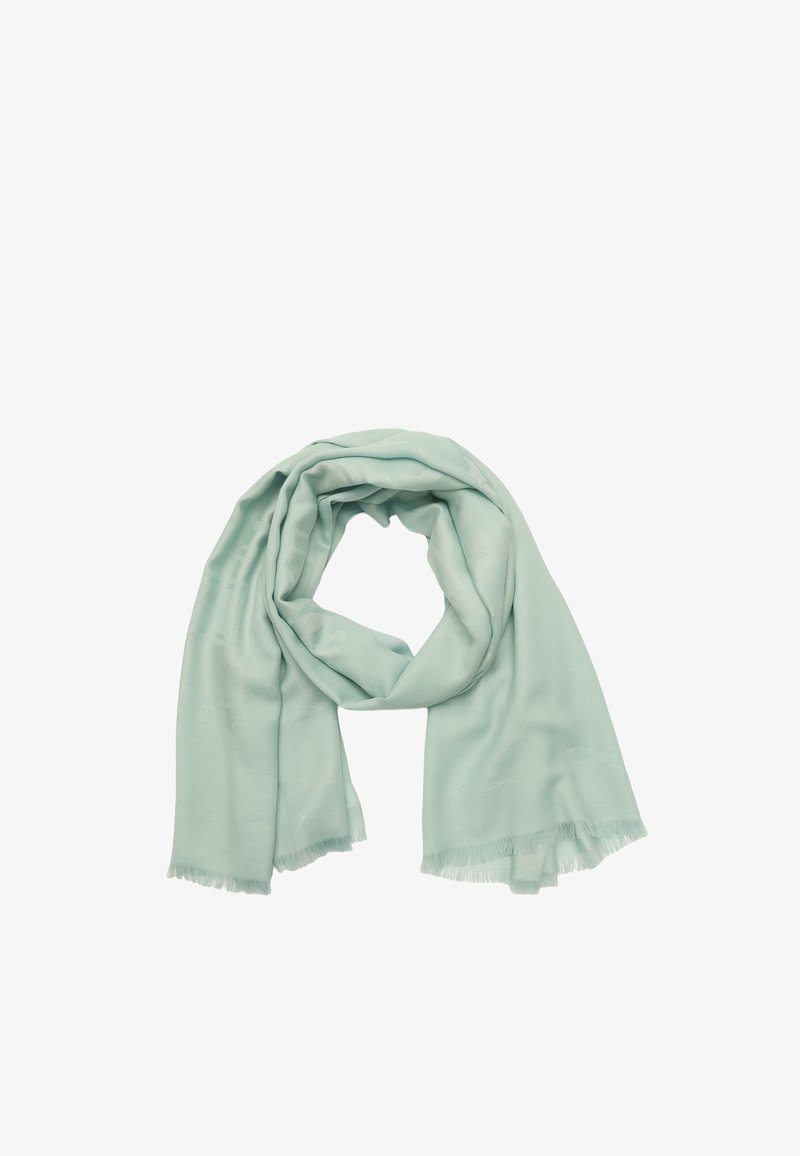 Écharpe vert menthe en tissu léger, avec une texture lisse et des bords effilochés. Drapée en une disposition circulaire lâche.