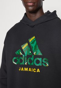 adidas Performance JAMAICA JFF SZN DK HOODIE - Džemperis ar kapuci - black
