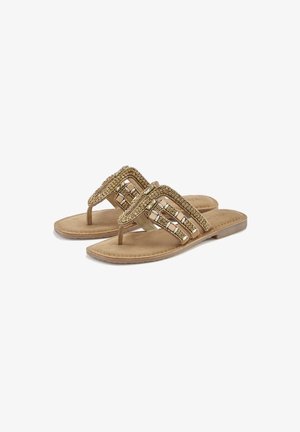 Gold-tone flat sandals with decorative bead and stone embellishments on the straps, featuring tan faux suede insole and textured sole.
