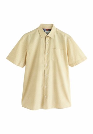 Lühikeste varrukatega kollane särk, millel on teemantmuster, nööpidega krae ja rinnaehe. Valmistatud kerge kangaga.