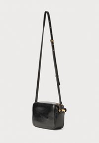 Black leather crossbody bag with a textured finish, rectangular shape, and adjustable strap. Features gold hardware and zip closure.