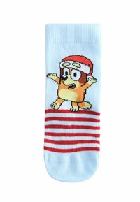Light blue sock with red and white horizontal stripes. Features a cartoon dog wearing a red Santa hat, with arms outstretched.