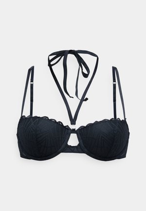 Soutien-gorge en dentelle noire avec armatures, bretelles réglables et lien autour du cou, présentant des motifs géométriques subtils sur le tissu.