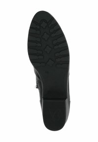 Suela de zapato negra con una superficie de goma texturizada y un patrón de tacón floral, además de un pequeño logotipo. El tacón tiene forma de bloque para mayor estabilidad.