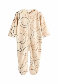 Fleece-Baby-Overall mit Reißverschluss; cremefarben mit verschiedenen lächelnden Gesichtern in Braun und Schwarz. Mit Füßchen und langen Ärmeln.