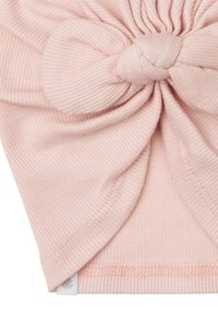 Rosa ribbad tygdiadem med en vriden knutdetalj framtill och en säker, sydd nederkant. Liten logotypetikett på sidan.