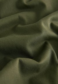 Olive green fabric with a smooth, slightly shiny texture, featuring soft folds and subtle sheen in a lightweight, stretchy material.