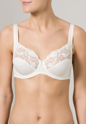 Witte lingeriebh met doorschijnende kant cups met bloemenborduurwerk, verstelbare bandjes en een delicat strikdetail in het midden.