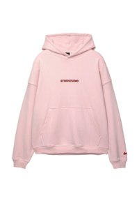 Light pink hoodie with a kangaroo pocket, oversized fit, and a dark pink "STWDSTUDIO" logo on the chest. Made from soft fabric.