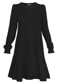 Robe noire à manches longues avec encolure ronde, épaules légèrement bouffantes, poignets ajustés et ourlet évasé à volants.