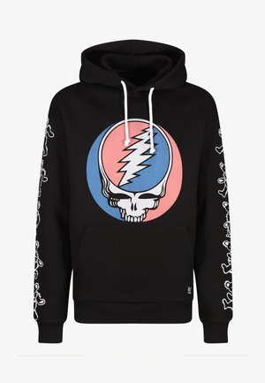 Hoodie noir avec un grand graphisme de crâne coloré dans un cercle. Les cordons de serrage blancs et les graphiques sur les côtés présentent des personnages de style cartoon. Texture de tissu douce.