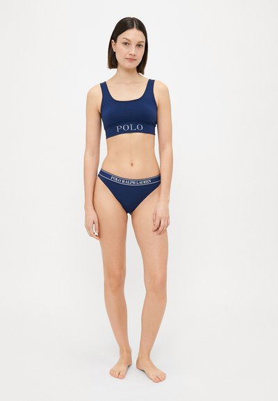 Navy blue cotton blend bralette and bikini set with "POLO" logo on the band. Soft texture, fitted design, and sporty style.