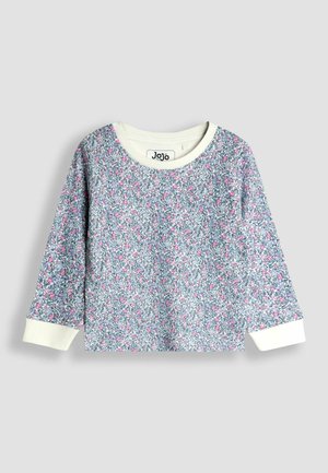 Dlhý rukáv s kvetinovým vzorom a okrúhlym výstrihom. Svetlo modrá základňa s ružovými a zelenými kvetmi. Biele manžety a golier. Mäkka tkanina.