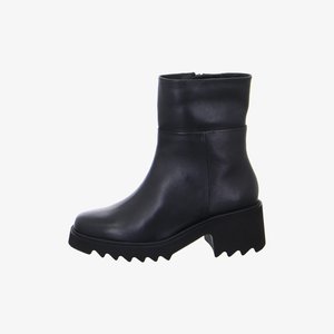 Black leather ankle boot with chunky, jagged sole and mid-height block heel, featuring smooth upper and side zipper closure.