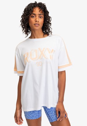 White cotton t-shirt with orange and white striped sleeves, featuring a "ROXY" logo and "ACTIVE 90 NATURE" text printed on the front.