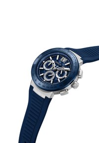 Orologio Cerruti 1881 con cinturino in gomma blu e cassa in acciaio inossidabile. Il quadrante blu presenta tre sottomisure, dettagli argentati e texture decorative.