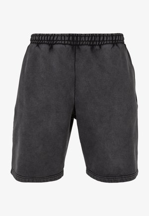 Mustadest puuvillast lühikesed püksid elasticse vöökohaga, küljetaskutega ja dekoratiivse õmblusega. Kangas on pehme ja mati tekstuuriga.