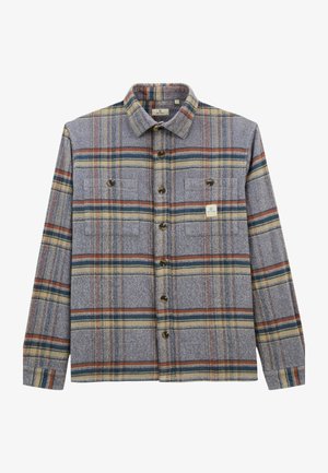 Chemise à carreaux grise à boutons avec des manches longues, deux poches poitrine et des rayures horizontales dans des tons orange, bleu et beige.