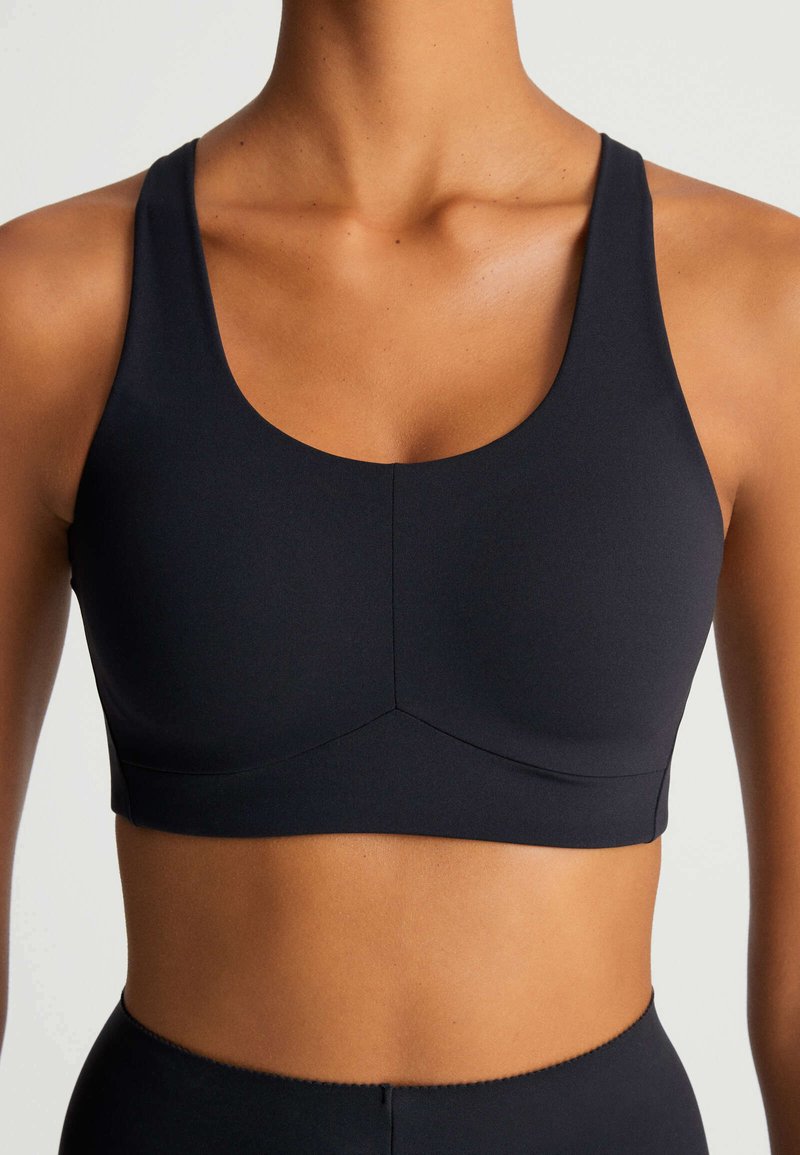 OYSHO COMPRESSION Sportbh met medium support black/zwart Zalando.nl