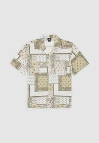 Camisa de manga corta en beige con varios patrones, incluidos motivos florales y lunares. Cuenta con cierre de botones en el frente y un bolsillo parche en el lado izquierdo.