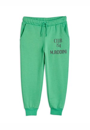 Grønne joggingbukser med snøre i taljen, sidelommer, ribkanter og teksten "CLUB 84 M.RODINI" på venstre lår.