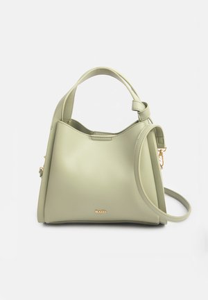 Light green leather handbag with short handle and detachable long strap, featuring small gold "RAID" logo on front.