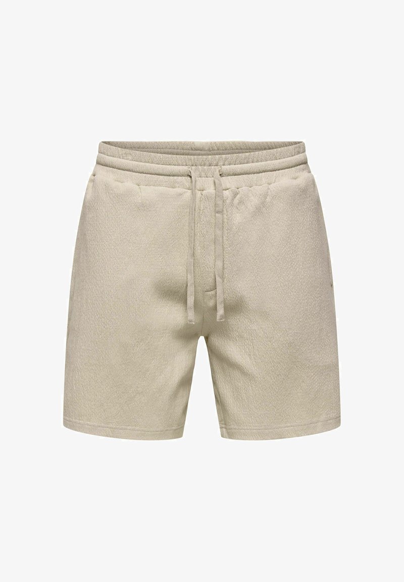Beige frottéshorts med elastisk linning og snøring, fremre lommer, og lengde til midt på låret.