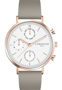 Rund vit urtavla med roséguld accenter, grå läderarmband, kronograf subdials och datumvisare.