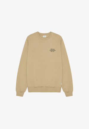 Beige pamut pulóver bordázott kerek nyakkivágással és mandzsettával. Az elülső részén fekete nyomtatott szöveg található: "LES DEUX COPENHAGEN EST. 2011".