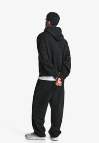 Bershka BALLOON - Jogginghose - black
