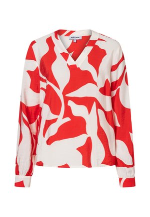 White long-sleeve blouse with bold red abstract leaf pattern and V-neck collar, displayed on a plain background.