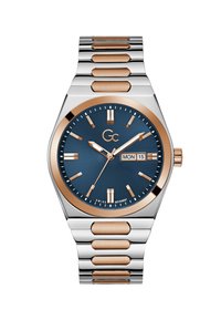 Ezüst és rózsaarany rozsdamentes acél karóra kék texturált számlappal, dátumkijelzővel és fluoreszkáló órjelzőkkel. Hivatott egy kapcsolt karkötő kialakítás.