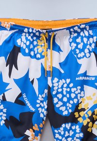 Badetights i en livlig blå farve med blomsterdesign i hvid, gul og sort. Elastisk talje med snøre i gul.