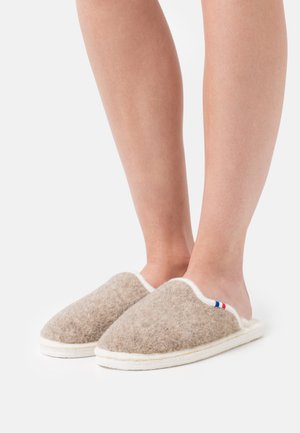 Felt slippers in light brown with white accents and a decorative red, white, and blue stripe; open back for easy wear.