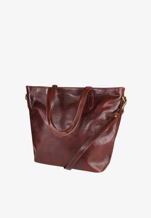 Bruine leren tas met twee handvatten en een afneembare schouderriem, voorzien van hardware in goudkleur en zichtbare stikselaccenten.