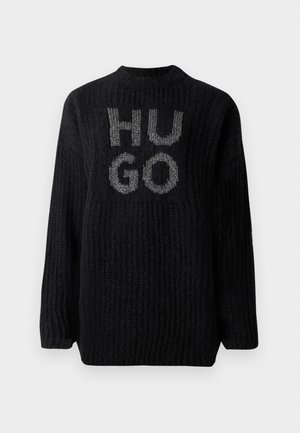 Maglione lavorato a maglia nero con trama a coste, scollatura rotonda e logo "HUGO" in argento sul davanti. Vestibilità oversize con maniche lunghe.