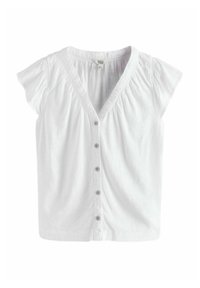 Blouse blanche à manches courtes avec un décolleté en V, cinq boutons sur le devant et des détails froncés aux épaules. Tissu léger.