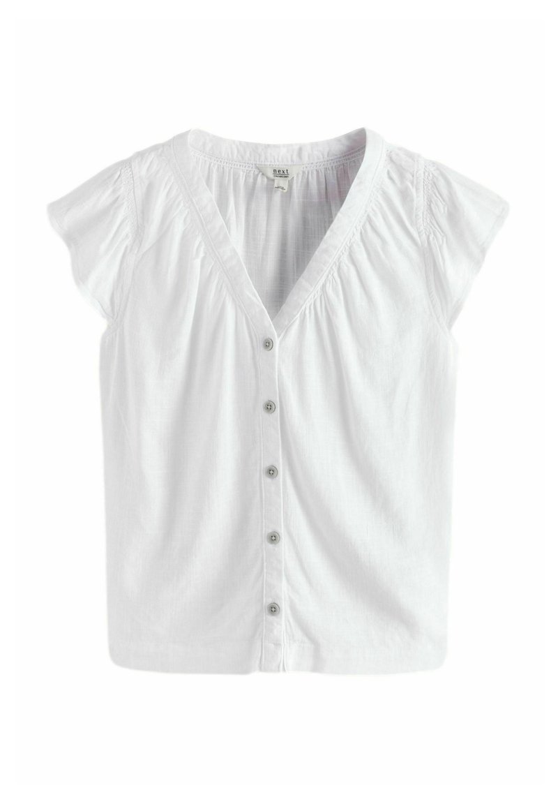 Blouse blanche à manches courtes avec un décolleté en V, cinq boutons sur le devant et des détails froncés aux épaules. Tissu léger.