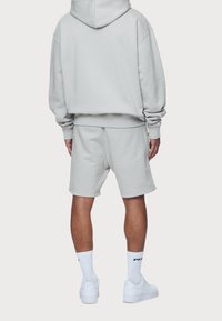 Pegador Jersey con capucha - light grey