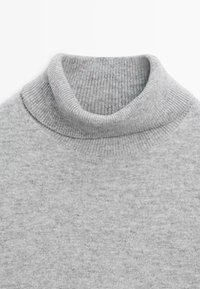 Gray turtleneck sweater made from a soft, textured knit. Features a ribbed collar and smooth body with a classic, fitted shape.