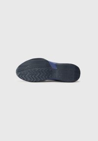 Dark blue sneaker sole with a textured, zigzag pattern for traction. Material appears rubber with sturdy construction and subtle branding accents.