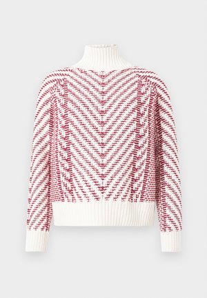 Sarkans un balts adīts džemperis ar augstu apkakli, kam raksturīgs zivju kaula raksts un ribota aproce un apakšmala. Mīksta tekstūra.