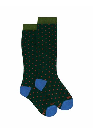 Calzini verdi con pois rossi, accenti blu nella punta e nel tallone, e un polsino verde a coste. Realizzati in un tessuto morbido ed elasticizzato.