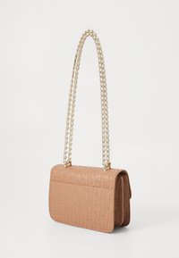 Tan leather bag with embossed pattern, featuring a gold chain strap and flap closure. Compact rectangular shape with a textured surface.